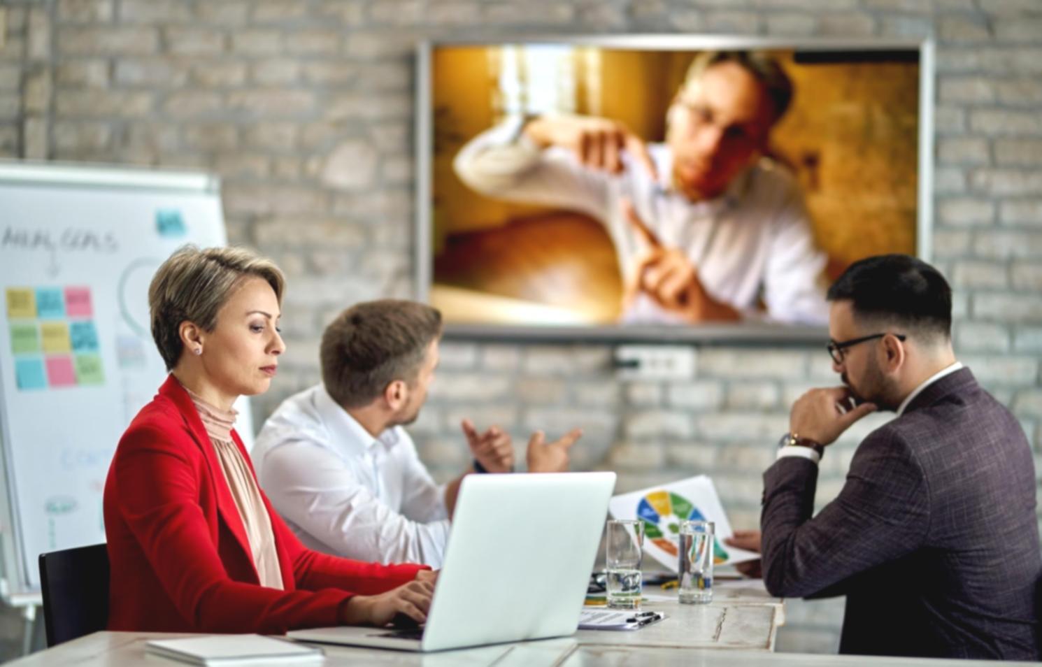 Person reviewing financial records at desk with focused attention
